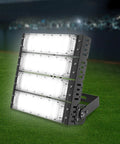 Stadium Flood Light 200W IP67 Water-Resistant 180° Adjustable Bracket on grass, showcasing durable aluminum and bright illumination.