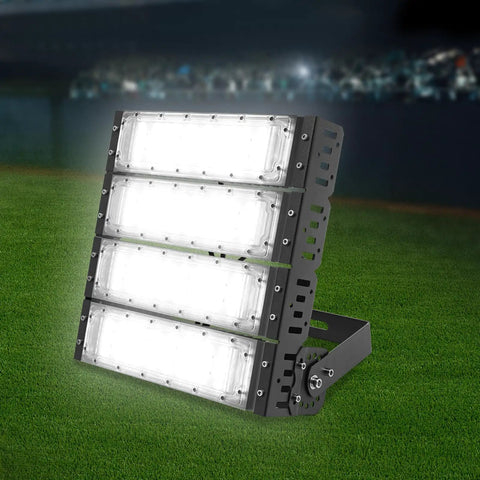 Stadium Flood Light 200W IP67 Water-Resistant 180° Adjustable Bracket on grass, showcasing durable aluminum and bright illumination.