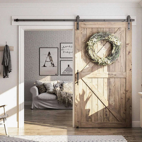 8 Foot Sliding Barn Door Hardware Kit with track and pull handle, installed on wooden door, smooth quiet operation, 42 to 48 inch doors.