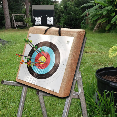 Backyard Archery Target Set for Compound and Recurve Bows, straw backstop with arrows on target in grassy yard