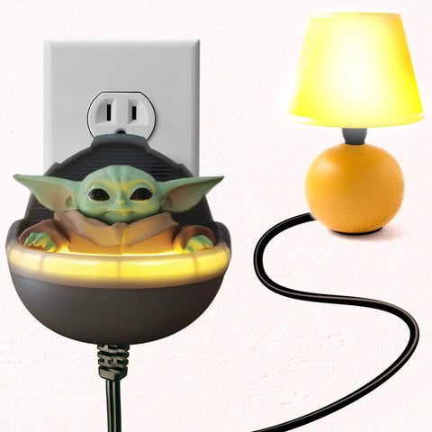 Star Wars Mandalorian Baby Yoda talking night light with clap activated switch plugged into wall outlet, lamp nearby