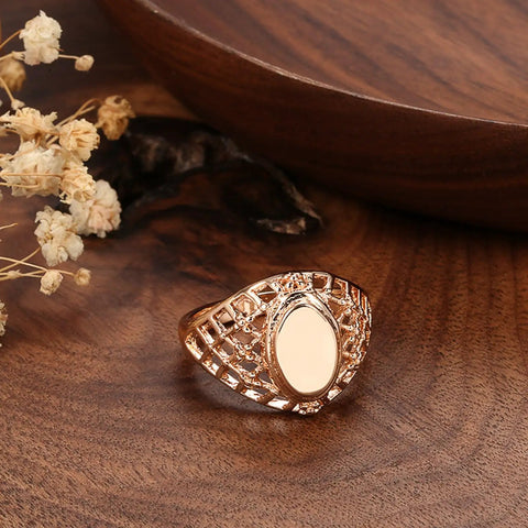 Fresh Rose Gold Oval Mesh Statement Ring For Women Featuring Sleek Polished Surface and Dope Openwork Grid Band on wooden surface.