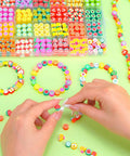 Colorful Fruit Polymer Clay Beads Bracelet Making Kit With Lemon Strawberry Avocado Watermelon Designs For DIY Jewelry Crafting Necklace And Bracelet Making Supplies, shown with beads and bracelets.
