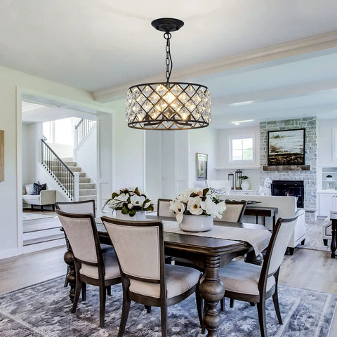 Three Light Modern Crystal Chandelier In Black Metal Farmhouse Pendant Light With E26 Base over a dining room table.