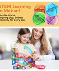 Mother and daughter playing with Totally Fun 8 Piece Marbles For Magnetic Block Tiles Marble Run Tracks Set, colorful track pieces.