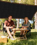 Couple under 3x10 Black Fence Privacy Screen For Outdoor Shade And Balcony Decor, Heavy Duty HDPE Mesh Fence Cover For Apartments, Deck, Backyard, Or Pool Area, Delivers 95 Percent Shade And Real Privacy