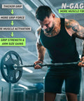 Man using Angled Barbell Grips Pro for Joint Support and Muscle Activation in gym setting