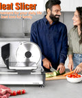 Heavy Duty 200W Electric Meat Slicer With Twin 7.5 Inch Stainless Steel Blades Adjustable Thickness Control For Deli Style Roast Beef Cheese And Bread Perfect Home Kitchen Upgrade Easy Clean Design in use with fresh vegetables.