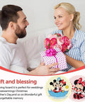 Couple exchanging gifts with cartoon diamond painting coasters featuring Mickey and Minnie Mouse shown below.
