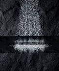 Bancroft 2.5 GPM Single Function Showerhead With Katalyst Air Induction Technology water spray against dark background