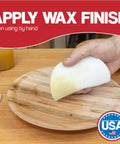 Applying wax by hand with a Five Inch Non Scratch Polishing Pad Set Of Ten Pro Grade Hooks And Loop Nonwoven Buffing Discs For Orbital Sander Use Non Abrasive Finishing Pads To Buff And Polish Finished Surfaces And Apply Wood Oils And Waxes For A Lustrous Shine on a wooden surface.