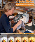 Woman using Pro Grade LED Magnifier With Light And Flexible Gooseneck 30x 10x Dual Zoom Five Color Modes for sewing work.