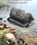 Waterproof Dry Bag 10L Roll Top Unisex Grab and Go Outdoor Gear on rocky shoreline, made of durable PVC material.