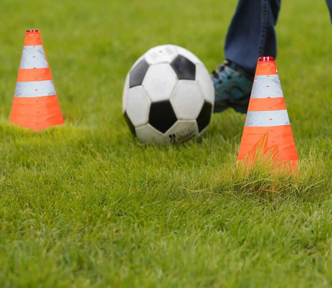 Soccer practice with Five Pack 18 Inch Collapsible Traffic Cones With LED Night Lights For Safe Parking And Roadwork.