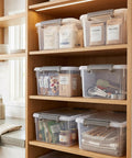 17 Quart Clear Plastic Storage Bins With Latching Lids stackable on kitchen shelves holding assorted dry goods and utensils