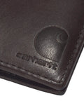 Premium Full Grain Leather Men Passcase Wallet With A Rich Oil Tan Shell And Soft Cotton Duck Lining Crafted For Hardcore Daily Grinds And Completely Reliable Carry close-up showing embossed logo and stitching.