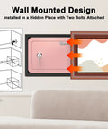 Wall-mounted pink mini safe for kids and home with key lock, shown installed in a hidden space for storing cash and documents.
