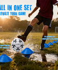 Child kicking soccer ball with blue cones in outdoor field, showcasing Backyard Pop Up Soccer Goals Set For Kids And Toddlers.