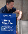 Man replacing Top Notch Replacement Filter For Whole House Air Purifiers MERV 11 20x25x4 Pack Of 1 USA Made in purifier system