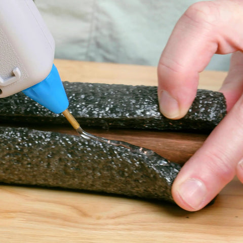 Applying glue with Full Size Hot Glue Gun Kit With 3 Nozzles, 75 Watt Heater, Ergonomic Grip, and Stringless Artistick Glue Sticks