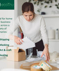 Woman packing box with Ultra Strong Kraft Paper Packing Tape For Boxes And Cartons, Beast Mode Sealing For Shipping And Moving.