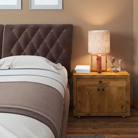 Bedroom nightstand with lamp and books next to a tufted headboard, featuring 36 Piece Round Cabinet Knob Set With Screws For Kitchen Cabinets Drawers And Bedroom Furniture 1.2 Inch Diameter Hardware Knobs Easy Install Durable Finish No Fuss Update.