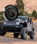 Jeep with off-road tires in desert terrain, inset shows close-up of wheel with 4 Pack Trailer Bearing Dust Caps 1.98 Inch Rubber Wheel Hub Caps For RV Snowmobiles