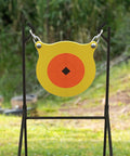 Boomslang AR500 Steel Shooting Gong Target 0.5 Inch Thick 9.5 Inch Diameter with Stand in outdoor setup