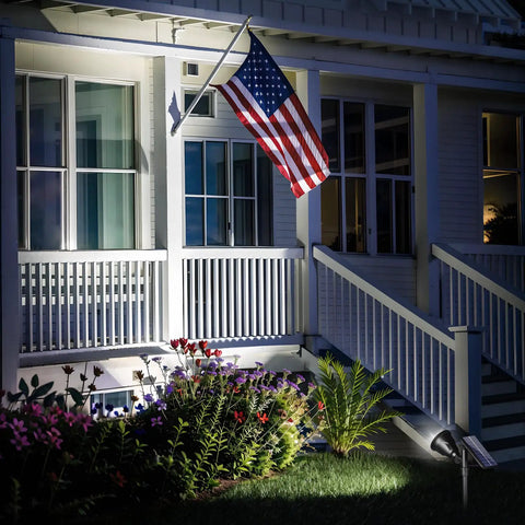 Solar Powered Outdoor Spot Lights 600LM Waterproof Flood Lights For Driveway Backyard Patio Garden Landscape Deck And Garage Cool White Two Pack illuminating house exterior at night