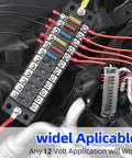Hella Tough 12 Way ATC ATO Blade Fuse Block Panel With Splash Proof Cover And Integrated Negative Bus For Trucks Rv Marine Auto Electrical Upgrade Projects installed in vehicle engine compartment.