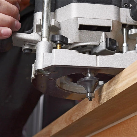 Close-up of Badass 30 Piece Router Bit Starter Kit One Quarter Inch Shank Tungsten Carbide Tipped Bits in use on wood.