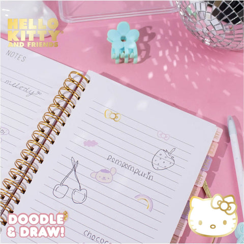 Hello Kitty Pink Gold Foil Journal Set For Girls with lined pages showing doodles, spiral binding, and tabs on pink background.