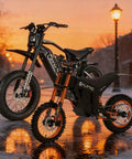 Robust Electric Dirt Bike Duo For Teens And Adults With Full Suspension Powerful Motors Crafted To Rip Through Gnarly Mountain Paths Snow Drifts Or Rough Off Road Trails Right Now, showcasing two bikes at sunset.