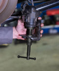 Person using Pro Grade Front And Rear Disc Brake Caliper Tool Set With 11 Adapters For Most Cars Piston Press And Caliper Rotation Kit