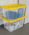 Tough As Nails 27 Gallon Plastic Storage Totes With Secure Locking Lids For Garage Organization stacked with tools and gear.