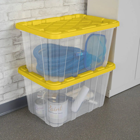 Tough As Nails 27 Gallon Plastic Storage Totes With Secure Locking Lids For Garage Organization stacked with tools and gear.