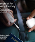 Person holding Wireless Bluetooth Audio Transmitter For AirPods And Headphones With 20 Plus Hour Battery next to travel bag