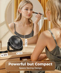 USB Desk Fan Portable Mini Personal Fan with 360 Degree Head on a vanity, woman applying makeup, sleek design.