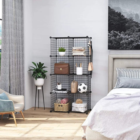 8 Cube Wire Grid Storage Organizer Dope Modular Shelving System with decor in modern bedroom corner, black metal grids.