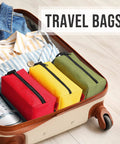 Travel bag with Rugged Five Pack Tool Pouches Set With 1680D Waterproof Fabric in red, yellow, green for sorting in open suitcase.