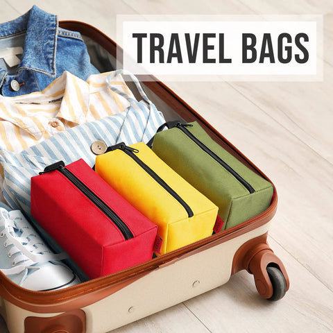 Travel bag with Rugged Five Pack Tool Pouches Set With 1680D Waterproof Fabric in red, yellow, green for sorting in open suitcase.