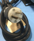 Electrical plug with three prongs, attached to a black cord designed for a 1/4 HP Belt Drive Motor Delivering Smooth Silent Operation At 1725 RPM On Split Phase 115V Frame 48 Specs Ideal For Whole House Fans Air Circulators And Blowers Running Solid Without Missing A Beat.