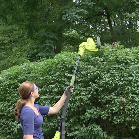 Person using Multi Angle Telescoping Electric Hedge Trimmer With Convertible Pole To Handheld 19 Inch Blade in garden