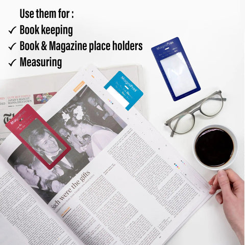 Person reading newspaper with 2 Pack Large Full Page Magnifying Sheet With 3X Magnification And 3 Fresnel Lens Bookmark Magnifiers nearby