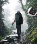 Back view of hiker with 40L Lightweight Hiking Backpack With Rain Cover Ripstop 210D Nylon Daypack in rainy forest trail