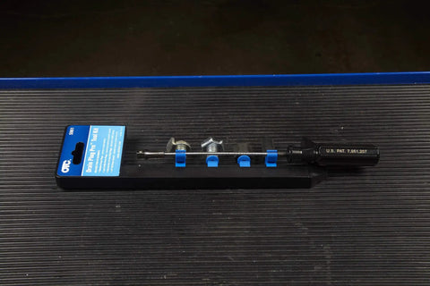 Drain Plug Pro Tool Kit With Interchangeable Attachments for Standard Low Profile and Internal Hex Plugs on black surface