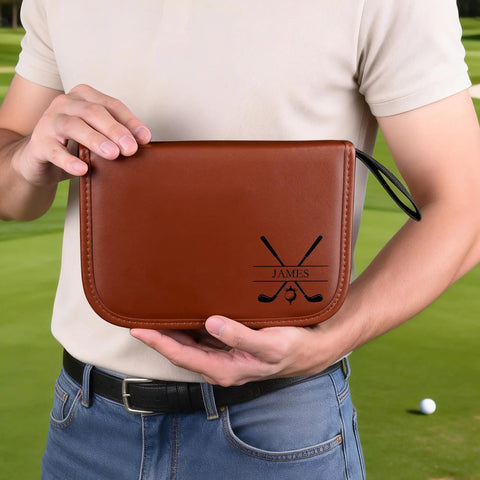 Custom Name Monogram PU Leather Golf Organizer Pouch With Engraving, brown pouch in hand, golf course background