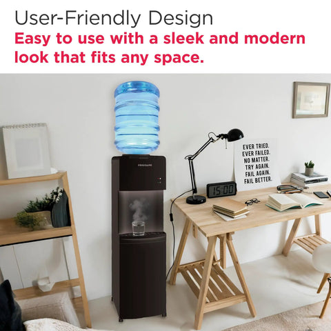 Top Loading Water Cooler Dispenser With Hot And Cold Water And Child Safety Lock Freestanding Slim Space Saving Design For Home Or Office No Fuss 3 Or 5 Gallon Bottles Black next to wooden desk in modern office