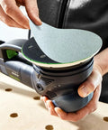 Person placing Granat Net P240 Grit PLANEX 8 7/8 Inch Diameter 225mm Abrasive Sanding Disc on tool for woodworking