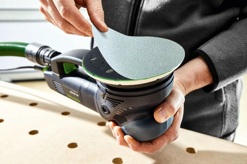 Person placing Granat Net P240 Grit PLANEX 8 7/8 Inch Diameter 225mm Abrasive Sanding Disc on tool for woodworking